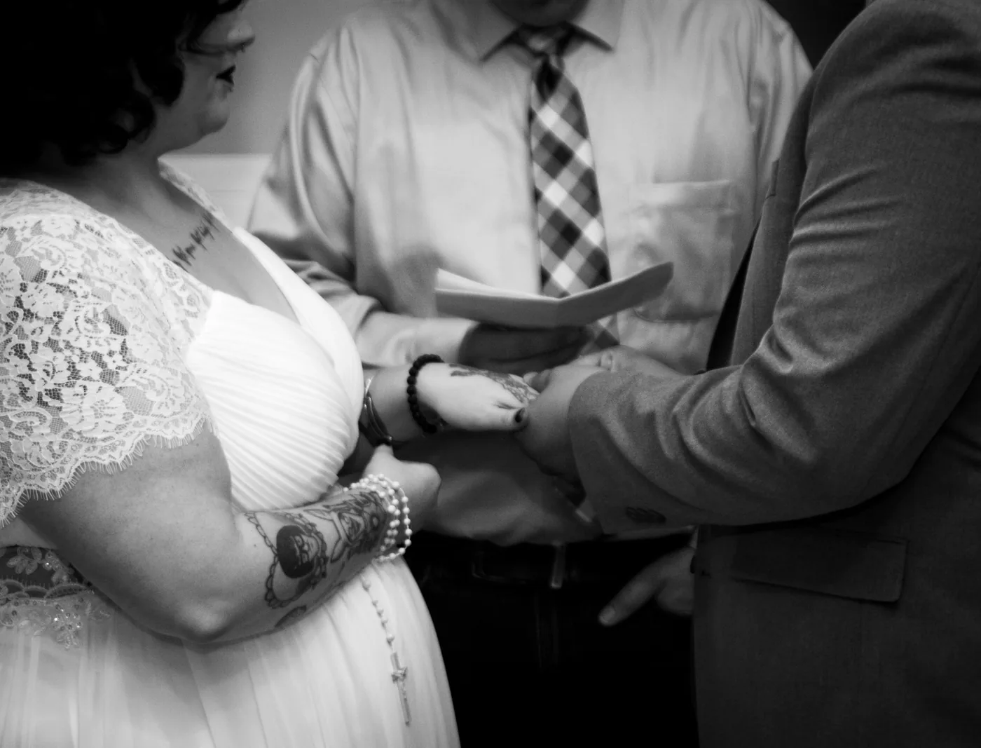 Couple holding hands during vows