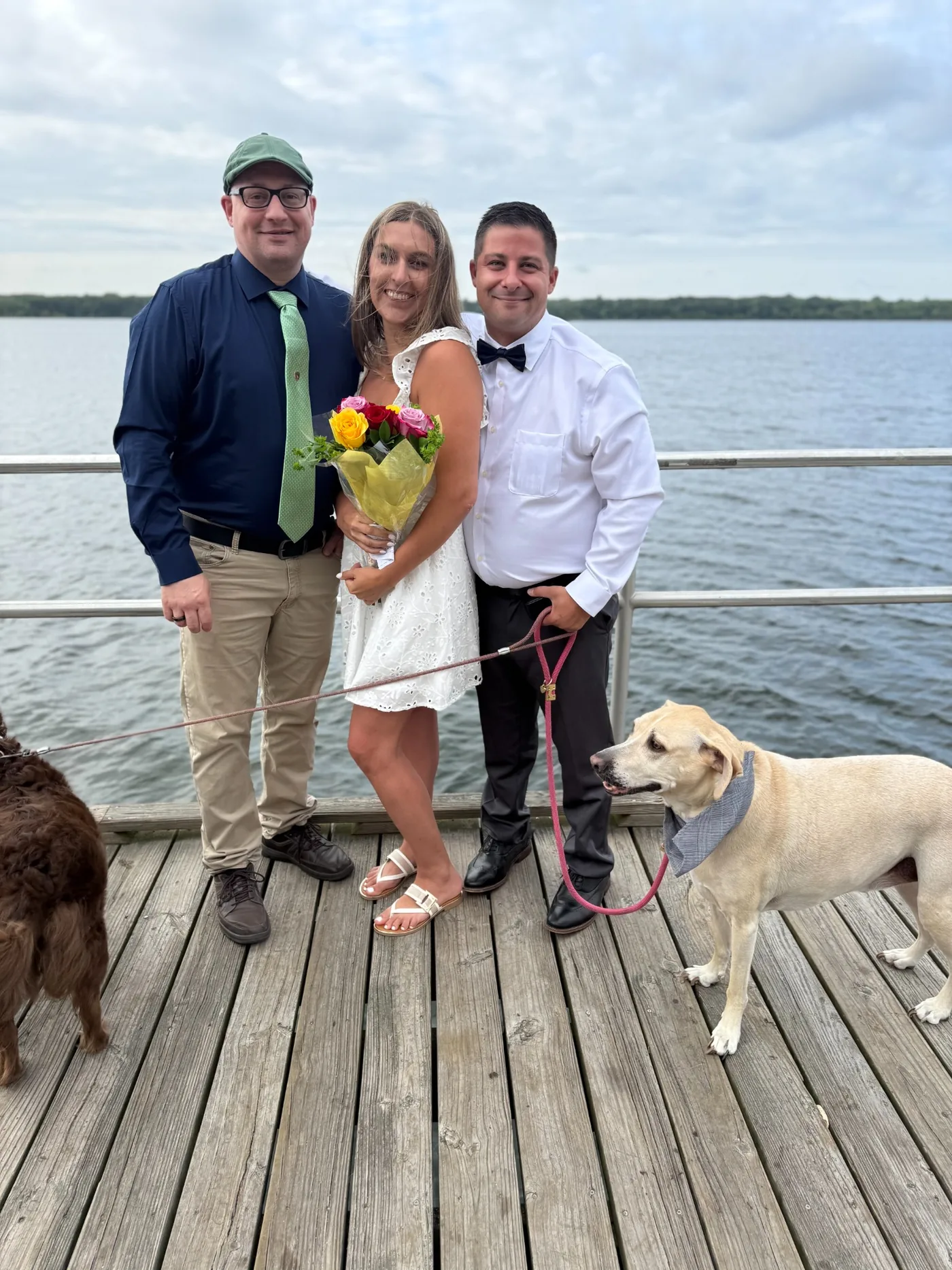 Wedding officiant with a newly married couple