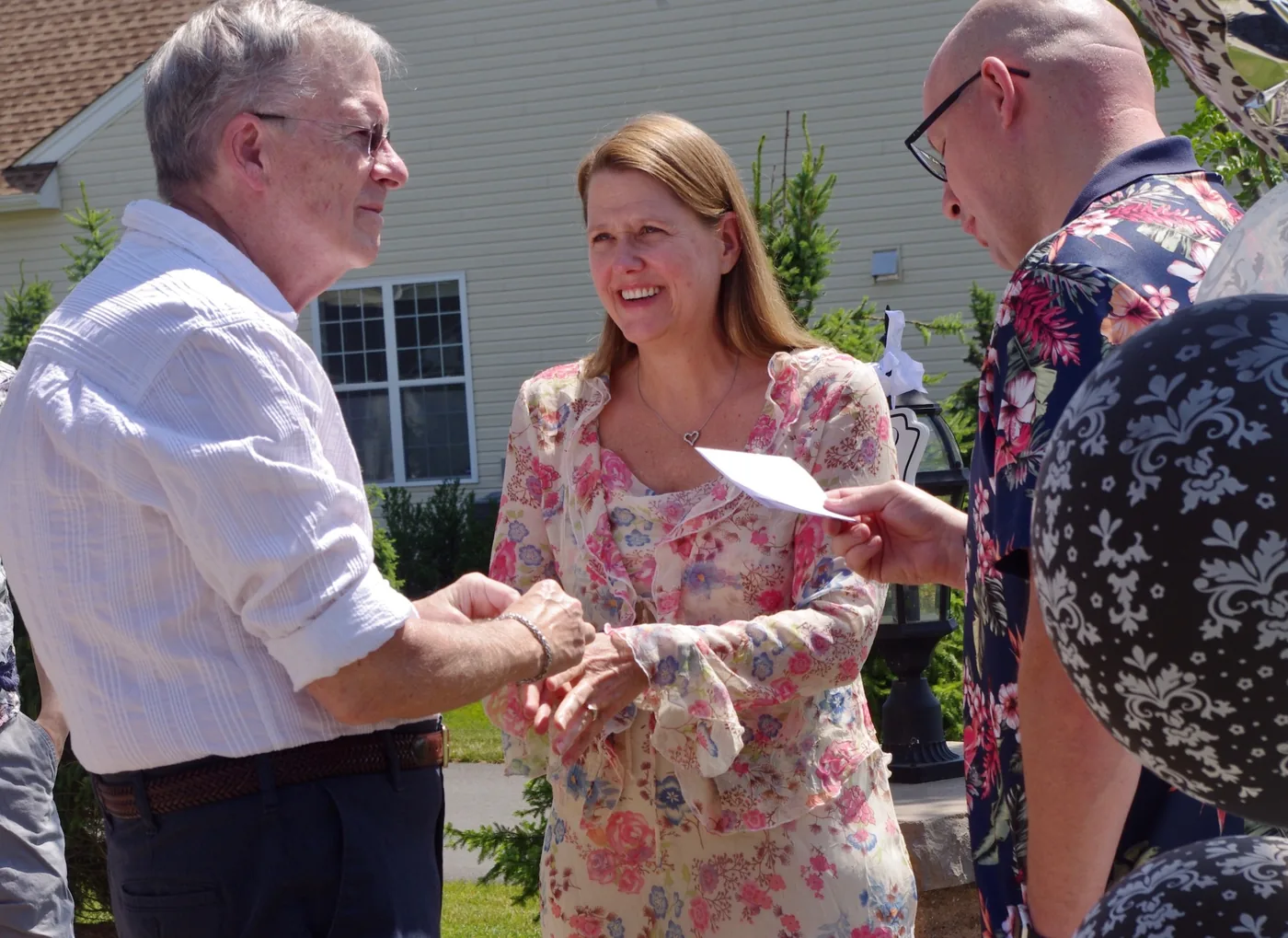 Waterfront wedding with the couple and officiant